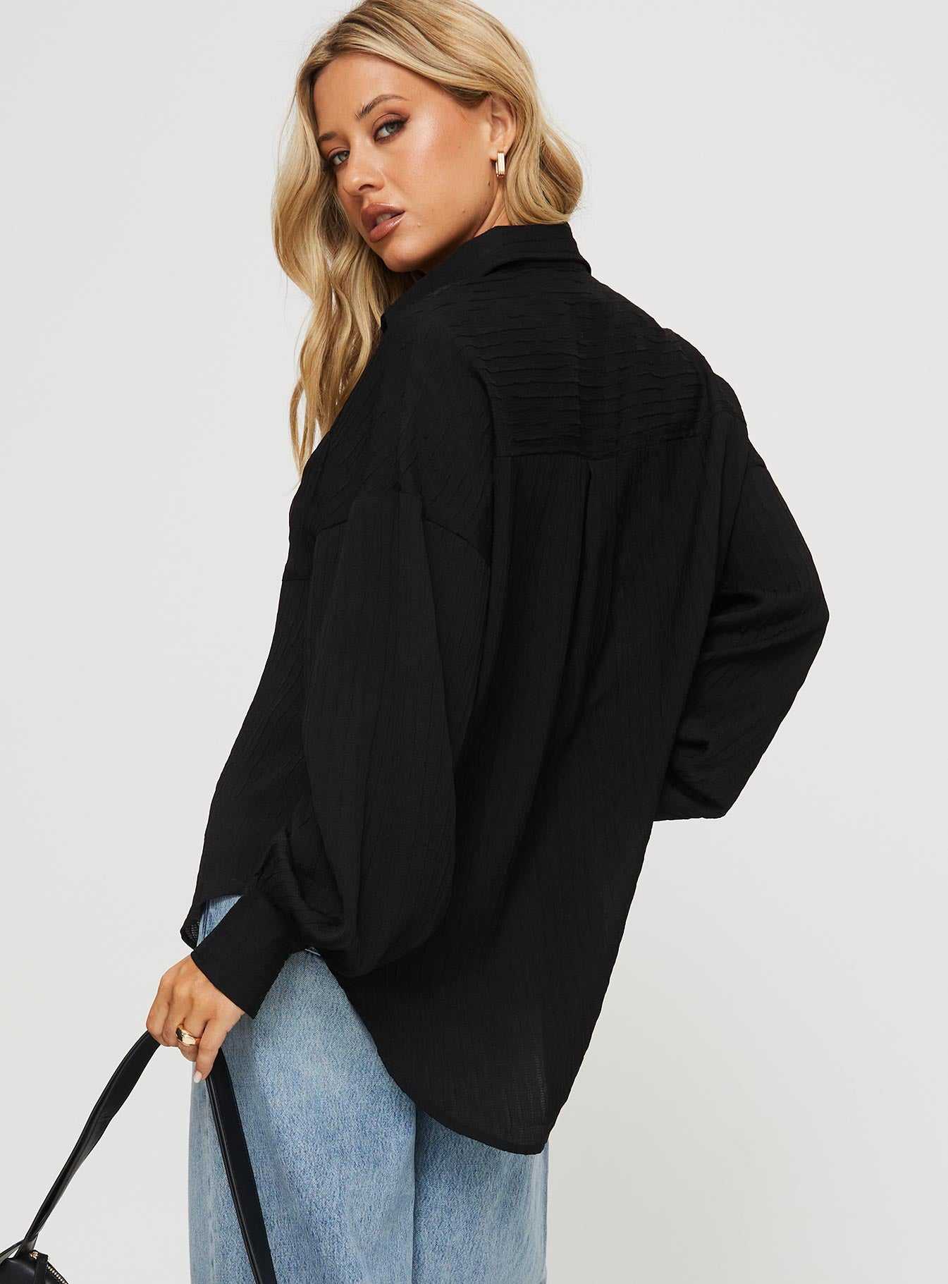 back view of model wearing Princess Polly Kamen Shirt Black Full Sleeves V-Neck 