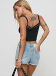 back view of model wearing Princess Polly Mitzo Mid Rise Denim Skort Light Wash High Waisted Shorts 