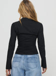 back view of model wearing Princess Polly Zifa Shirt Black Full Sleeves V-Neck 