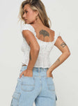 side view of model wearing Princess Polly Yvaine Top White Short Sleeves Square Neck 