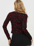 back view of model wearing Princess Polly Afia Long Sleeve Top Black / Red Full Sleeves Plunger 