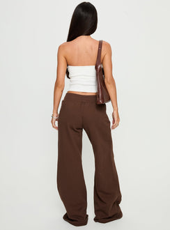 back view of model wearing Princess Polly Summits Flared Track Pants Chocolate High Rise Pants 