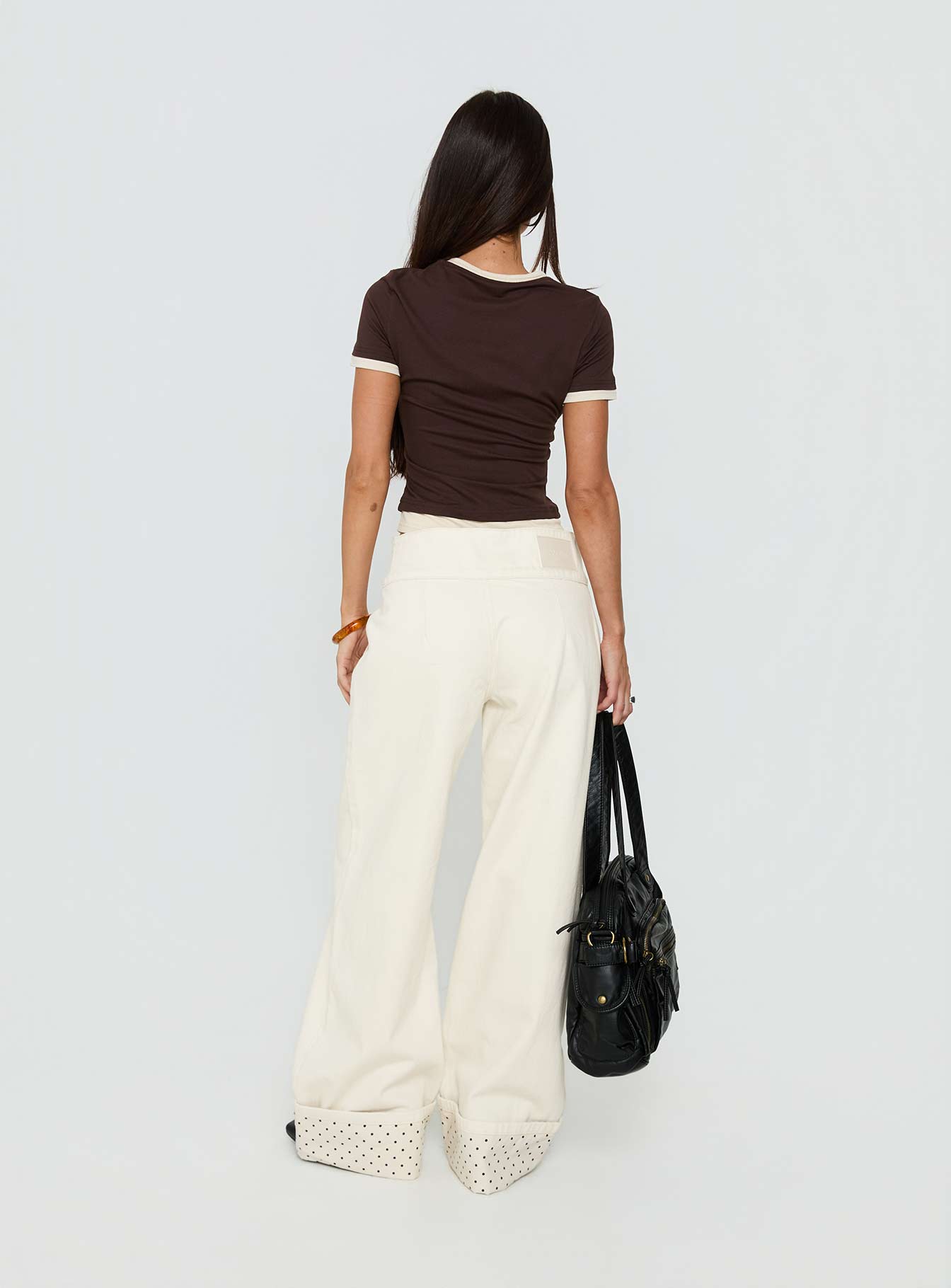 back view of model wearing Princess Polly Nikoletta Foldover Jeans Cream / Polka Mid Rise Jeans 