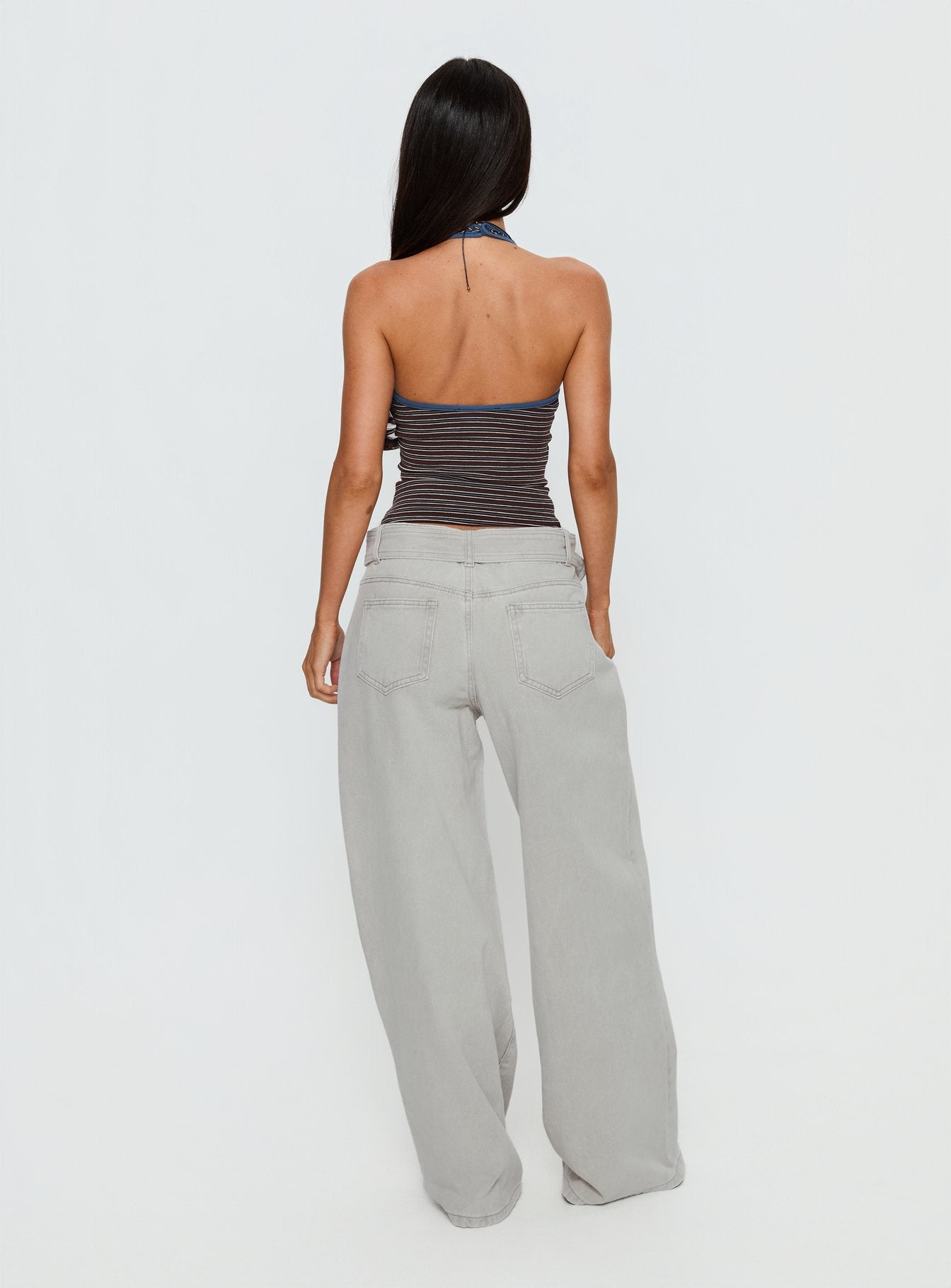 back view of model wearing Princess Polly Katlin Mid Rise Wide Leg Buckle Detail Jeans Grey Wash Mid Rise Jeans 