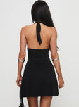 back view of model wearing Princess Polly Tinisie Halter Mini Dress Black Tall Plunger 