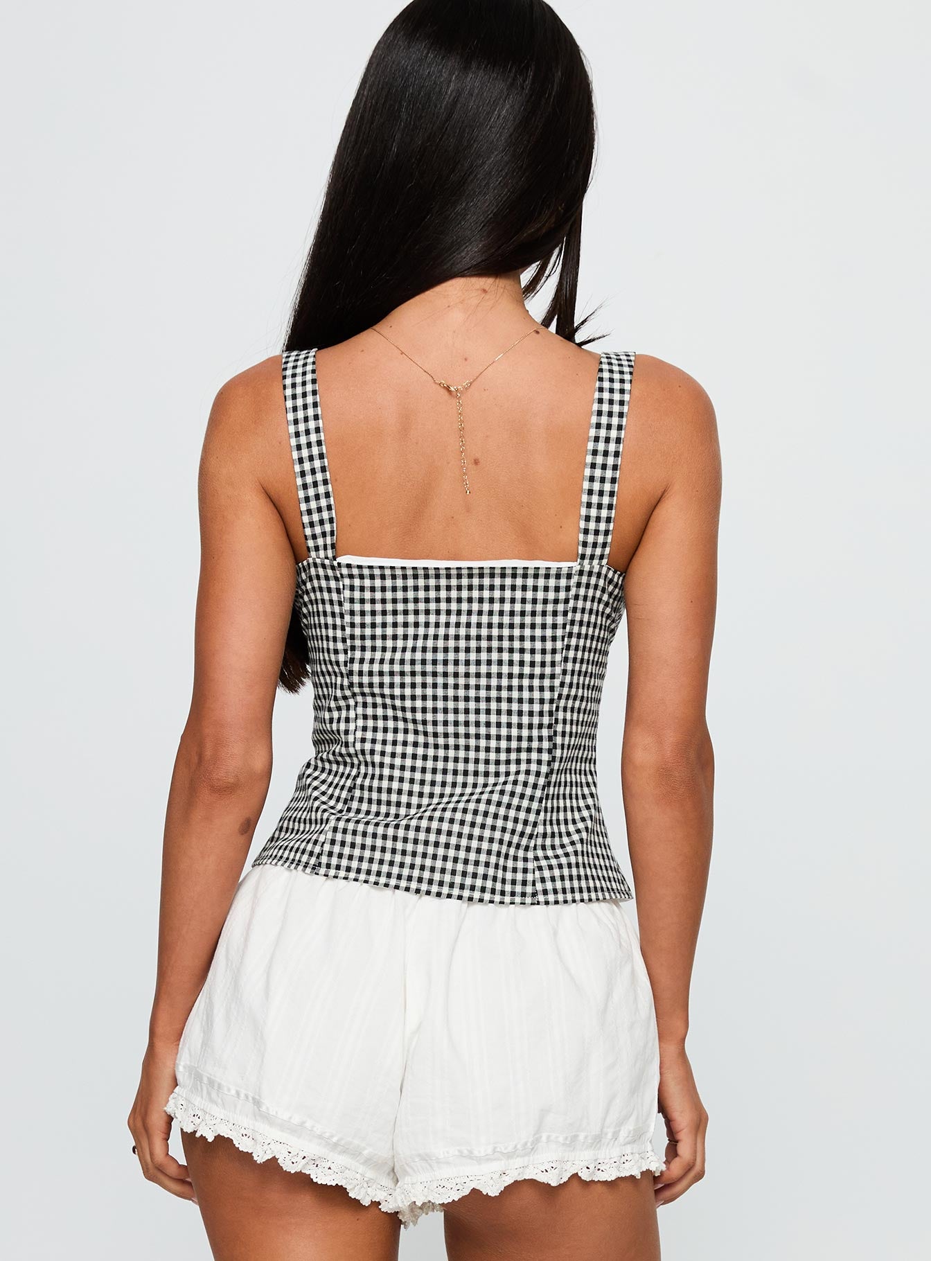 back view of model wearing Princess Polly Modern Girl Top Black Gingham Sleeveless Square Neck 