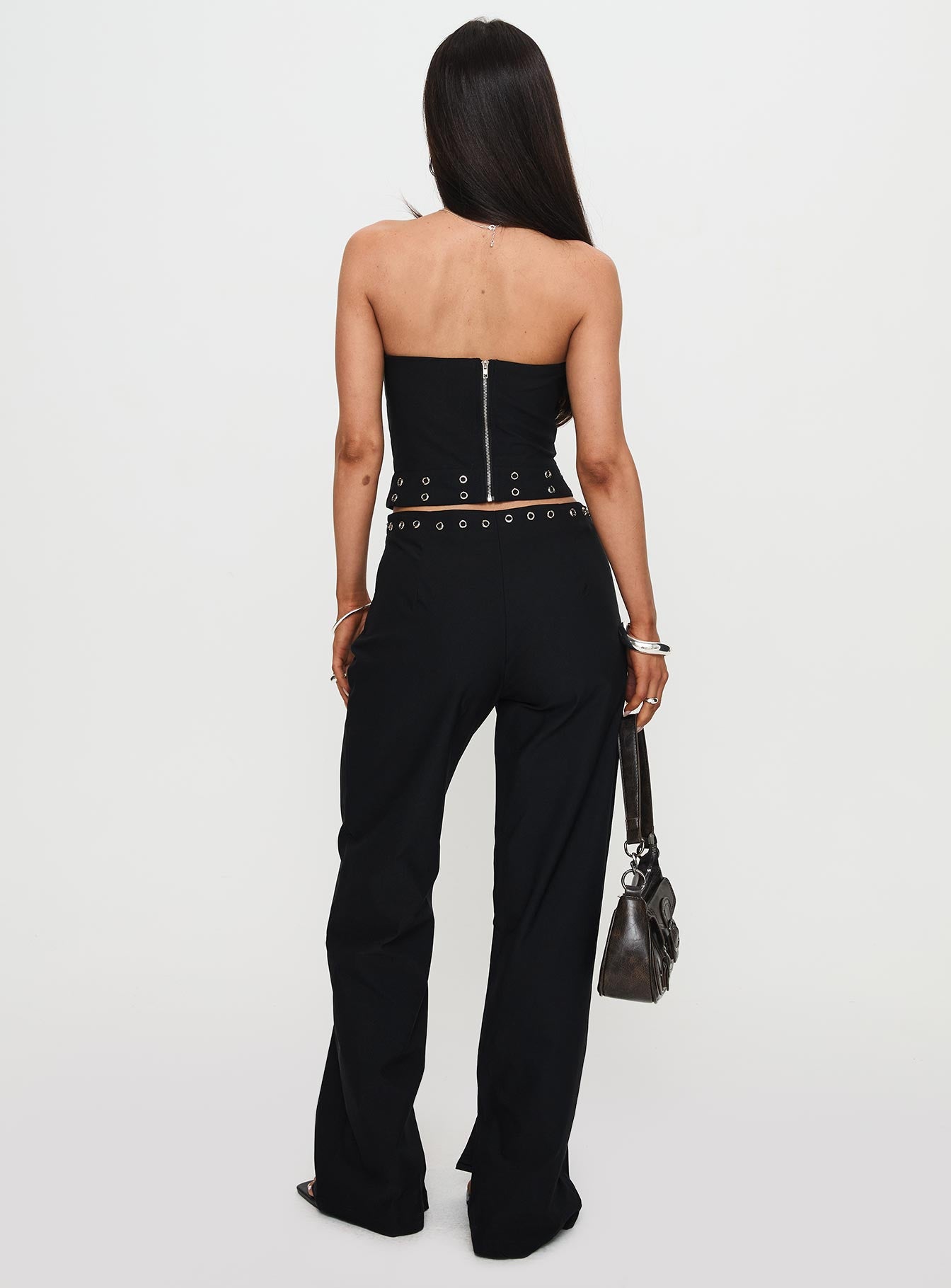 back view of model wearing Princess Polly Passionette Pants Black Petite High Waisted Pants 