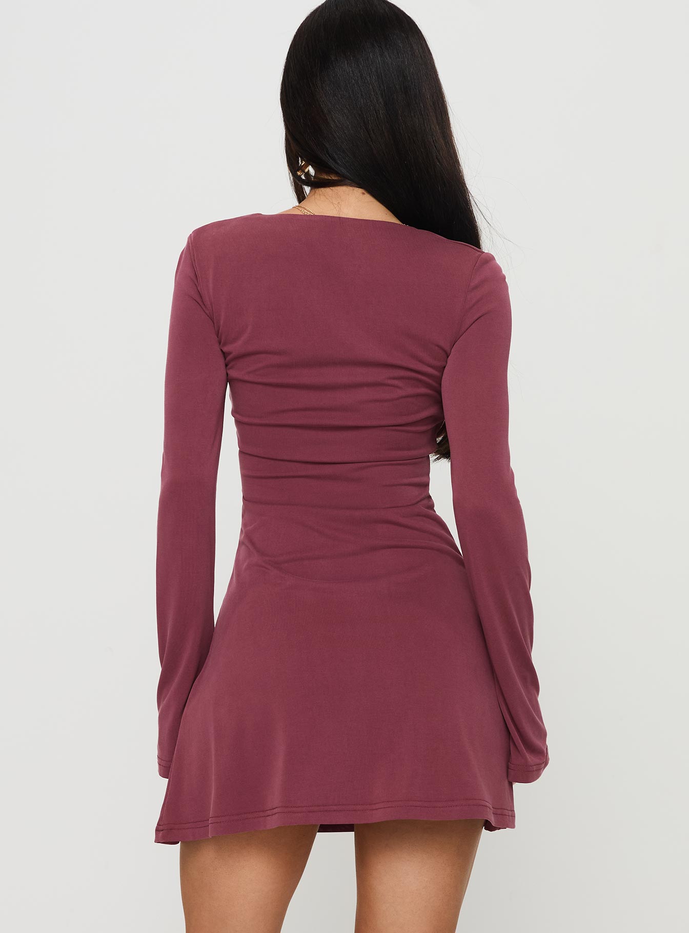 back view of model wearing Princess Polly Back In Time Long Sleeve Mini Dress Burgundy Square Neck 
