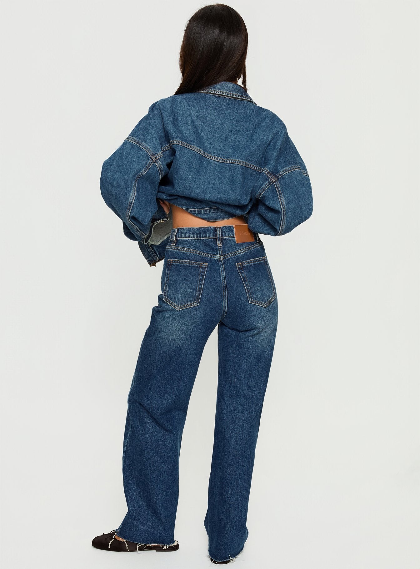 back view of model wearing Princess Polly Fawcett High Rise Straight Leg Jeans Dark Blue Wash High Rise Jeans 