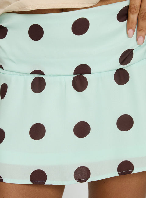 back view of model wearing Princess Polly Elicia Ruched Mini Skirt Mint / Chocolate Polka Dot Mini Skirts 