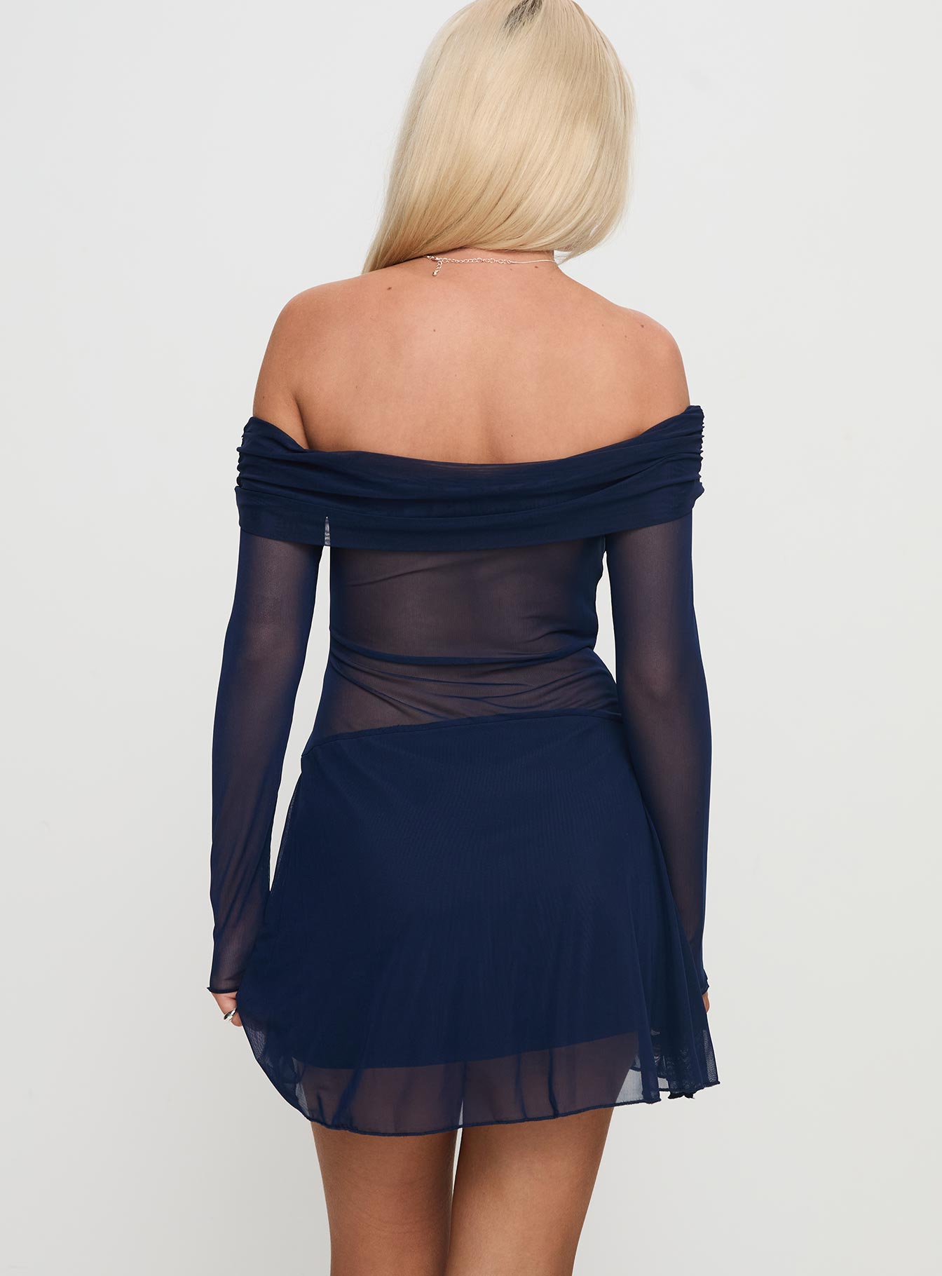 back view of model wearing Princess Polly Virtues Long Sleeve Sheer Mini Dress Navy Straight Neck 