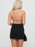 back view of model wearing Princess Polly Plus One Mini Dress Black Asymmetric Neckline 