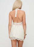 back view of model wearing Princess Polly Lumache Lace Mini Skirt Cream Mini Skirts 