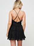Sheer lace mini dress Adjustable shoulder straps, plunging neckline, invisible zip fastening at back, tiered skirt