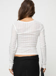 Long sleeve knit top, wide neckline Good stretch, unlined, sheer