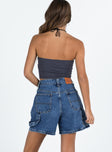 back view of model wearing Princess Polly Lou Carpenter Denim Shorts Mid Wash Lower Impact High Waisted Shorts 