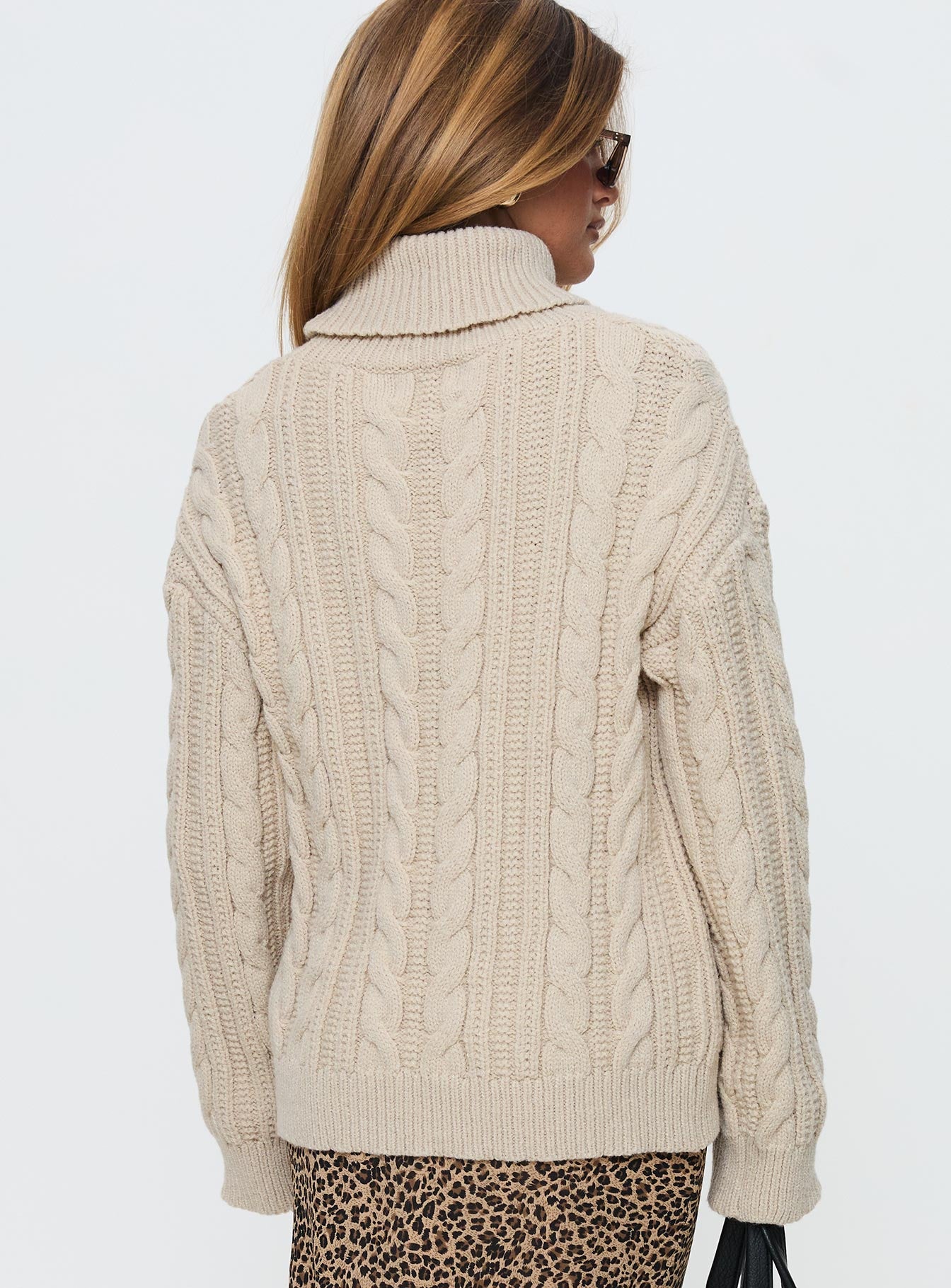 back view of model wearing Princess Polly Bryden Turtleneck Cable Knit Sweater Beige Long 