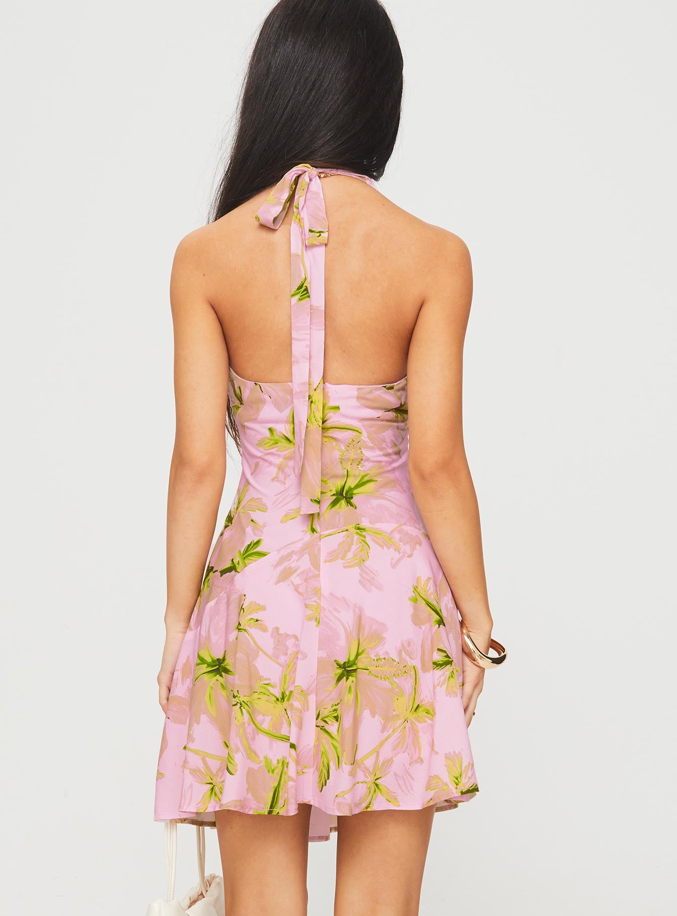back view of model wearing Princess Polly Alcedo Halter Mini Dress Pink / Green V-Neck 