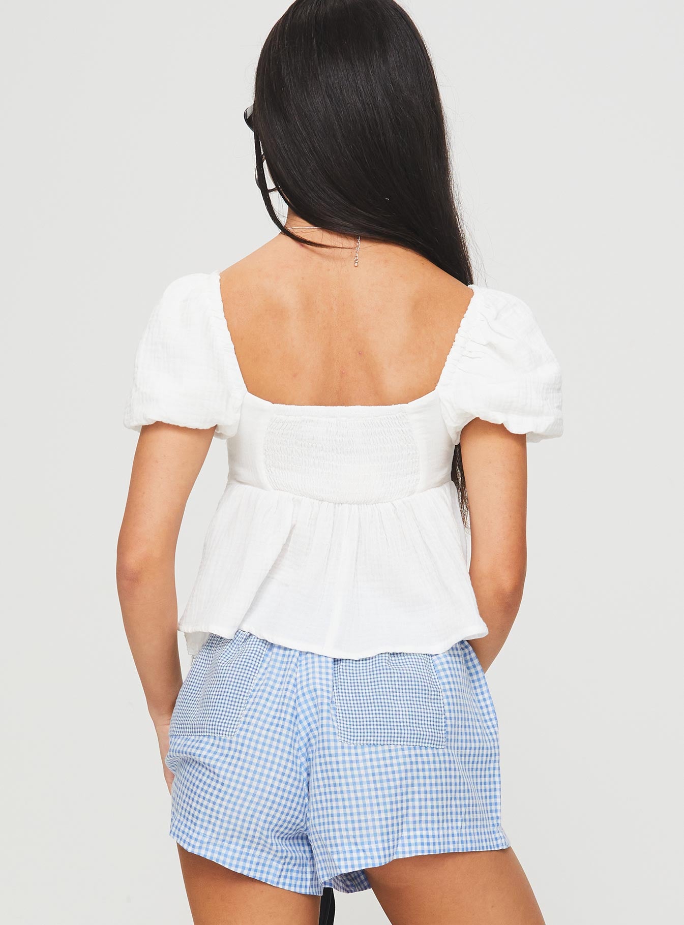 back view of model wearing Princess Polly Gus Top White Short Sleeves Square Neck 