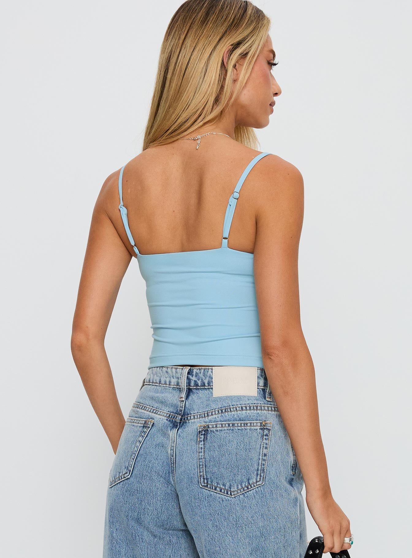 back view of model wearing Princess Polly Evanda Top Light Blue Sleeveless Sweetheart 