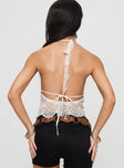 back view of model wearing Princess Polly Macchiato Halter Top Cream Sleeveless Plunger 