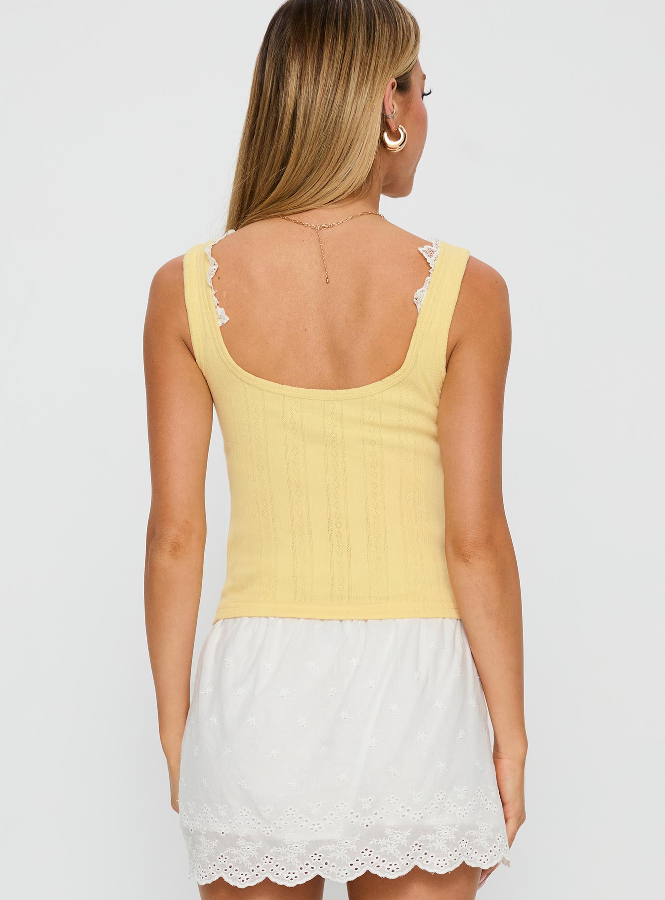 back view of model wearing Princess Polly Sole Purpose Lace Trim Top Yellow Sleeveless Scoop Neck 