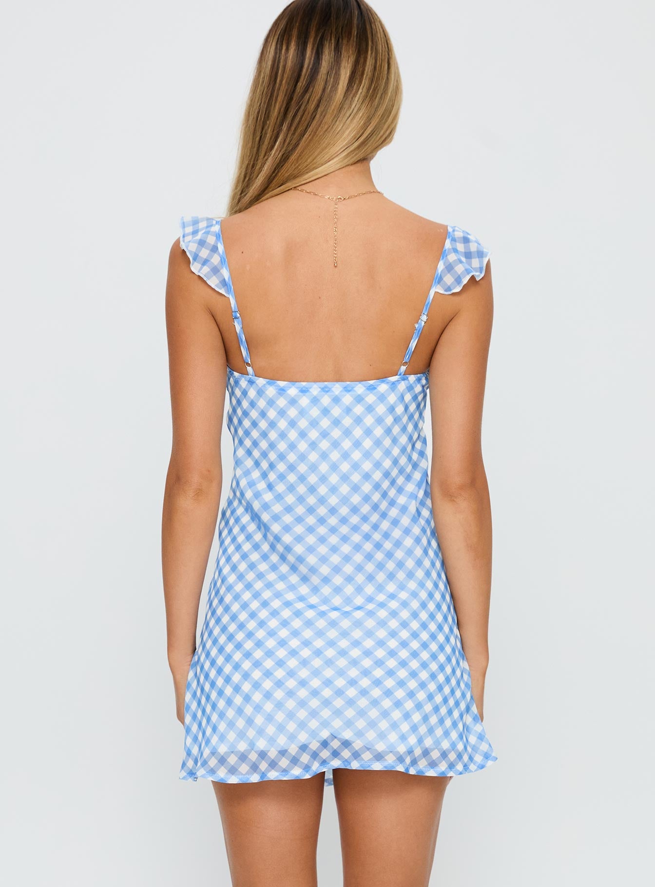 back view of model wearing Princess Polly Marseilla Mini Dress Blue Check Sweetheart Neckline 