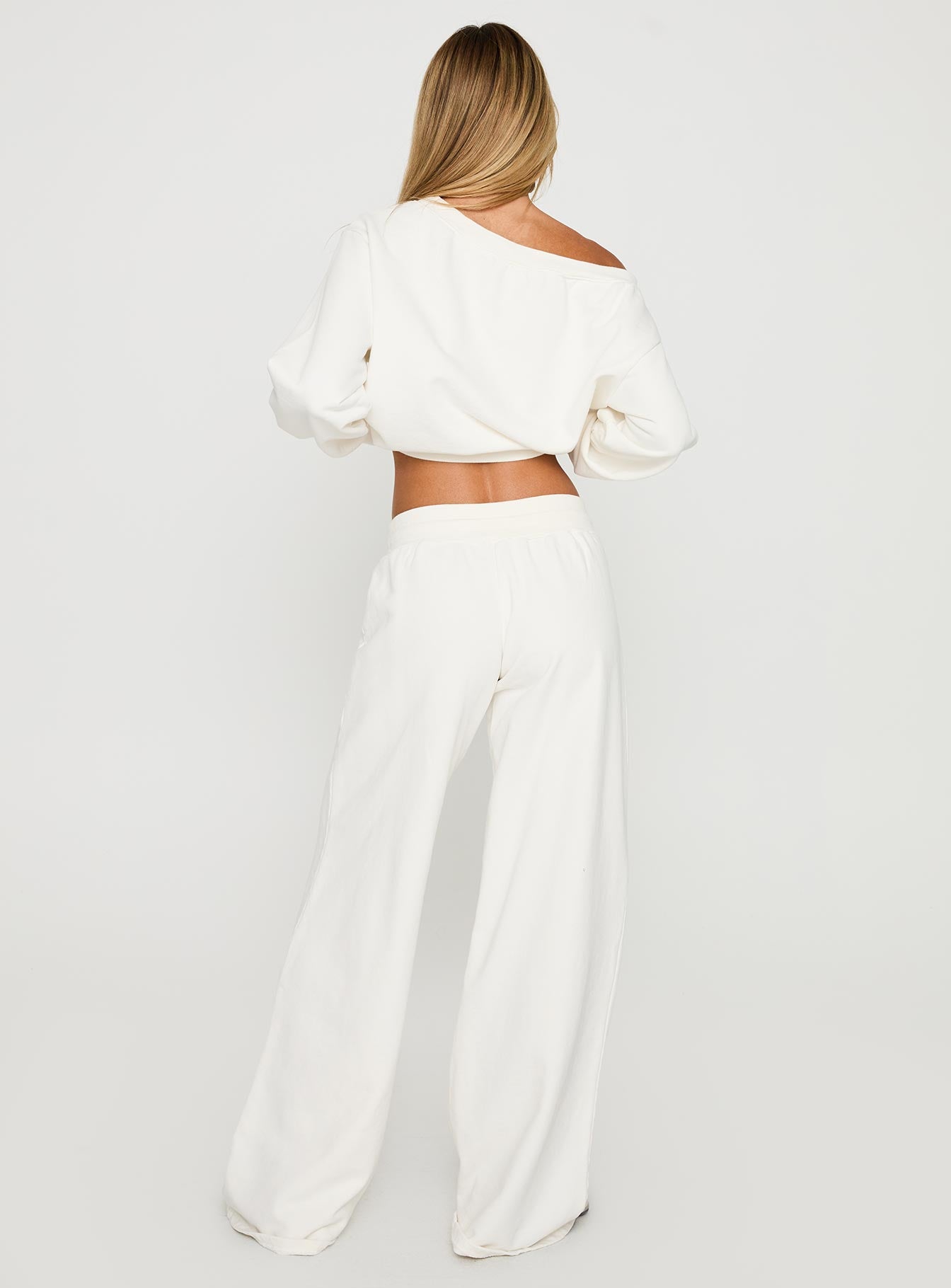 back view of model wearing Princess Polly Dodie Wide Leg Pants Washed White High Rise Pants 
