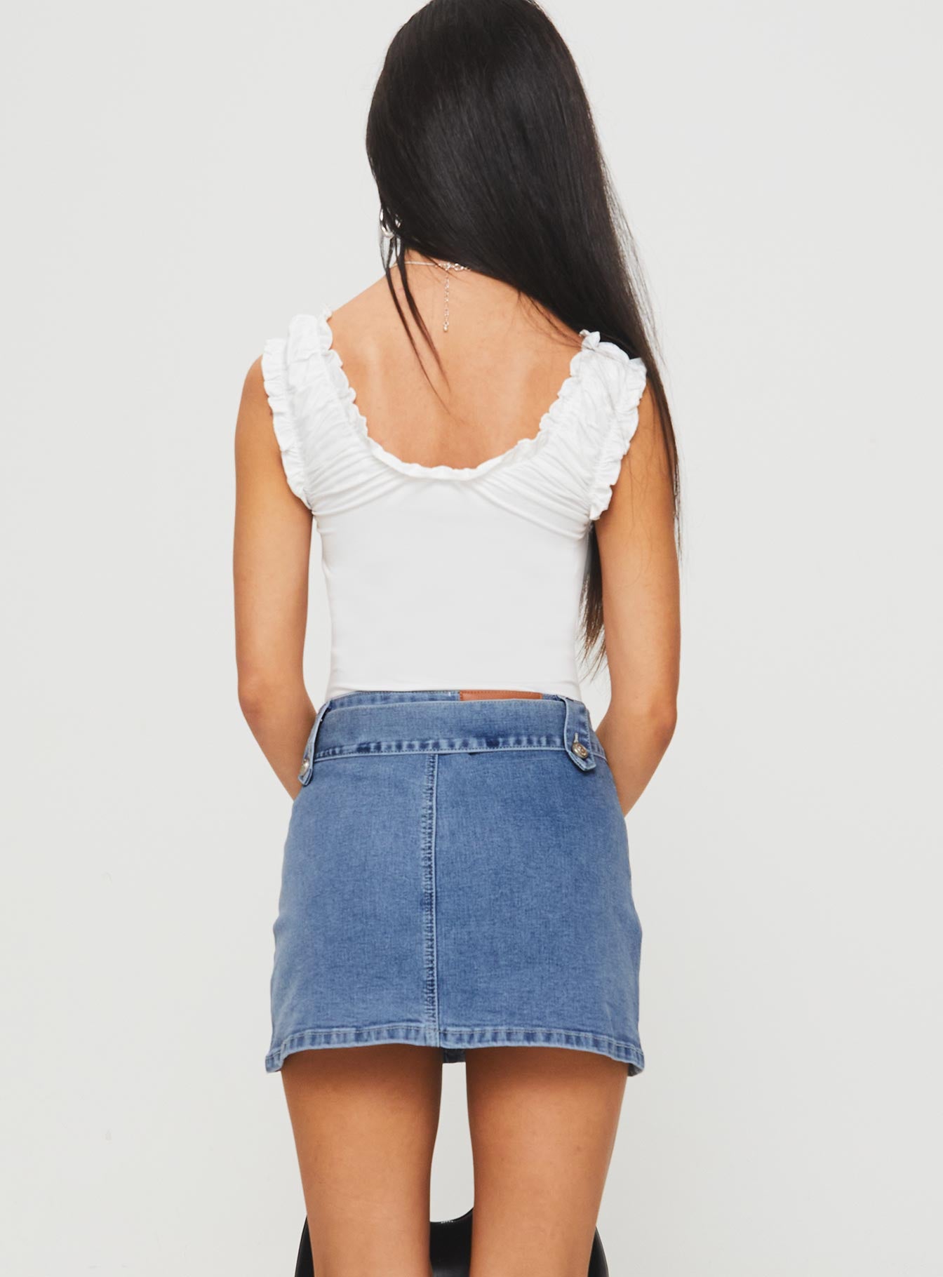back view of model wearing Princess Polly Domino Mini Skirt Mid Blue Denim Mini Skirts 