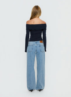 back view of model wearing Princess Polly Ellanor Low Rise Slouch Denim Jean Washed Mid Blue Wash Low Rise Jeans 