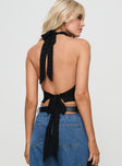 back view of model wearing Princess Polly Zephria Sheer Halter Top Black Sleeveless High Neck 