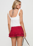 back view of model wearing Princess Polly Deei Double Ruffle Mini Skort Poppy Red Low Rise Shorts 