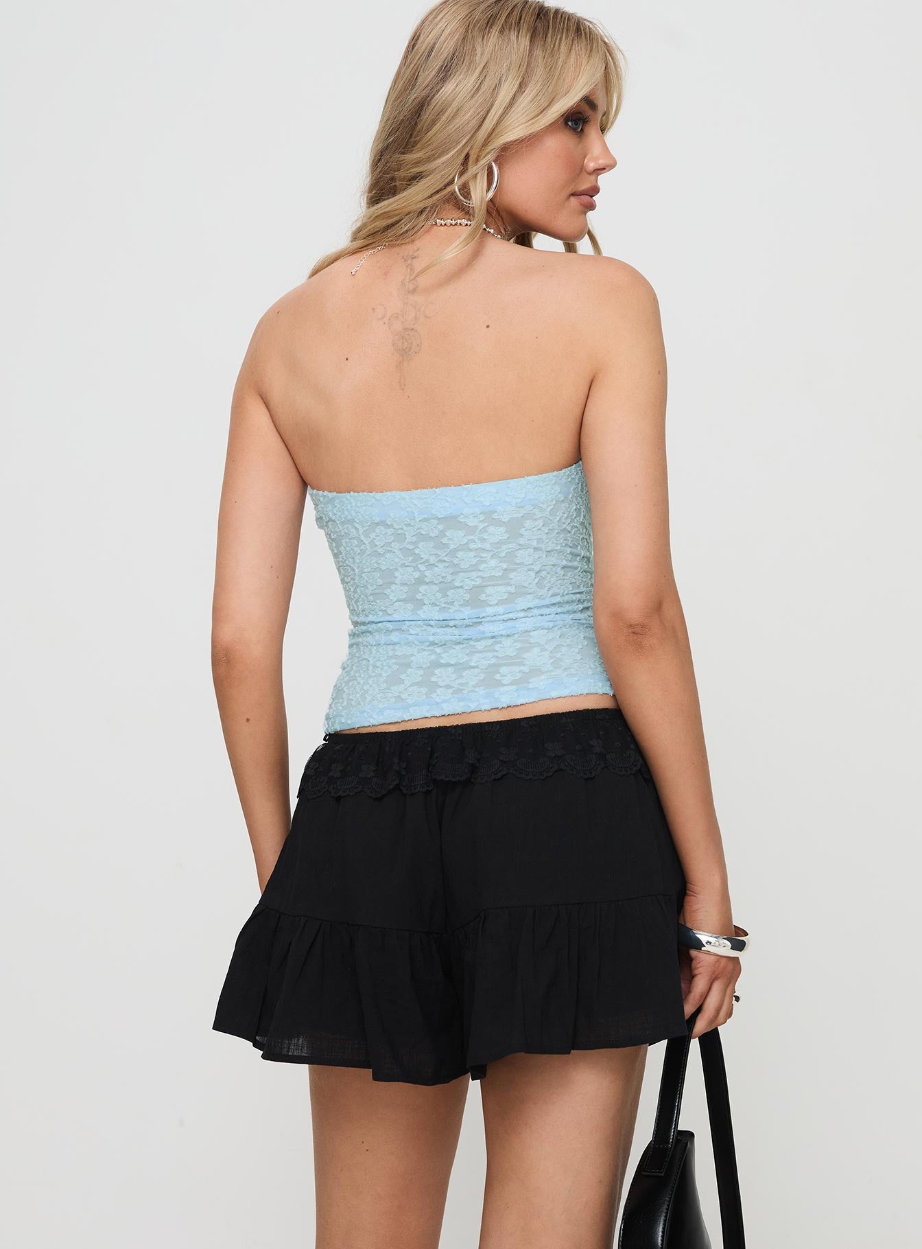 back view of model wearing Princess Polly Reynard Shorts Black Low Rise Shorts 