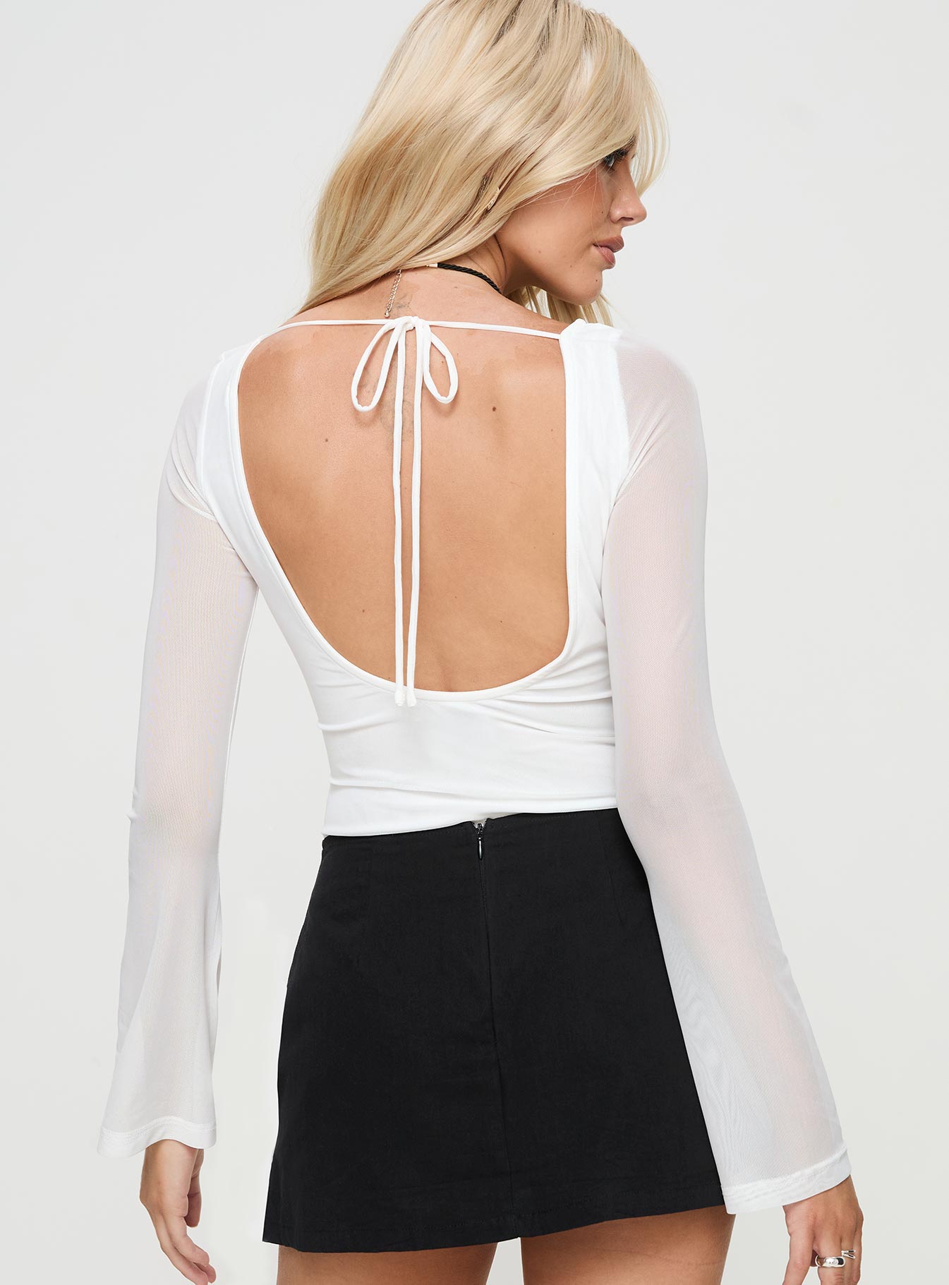 back view of model wearing Princess Polly Lukea Long Sleeve Bodysuit White Full Sleeves 