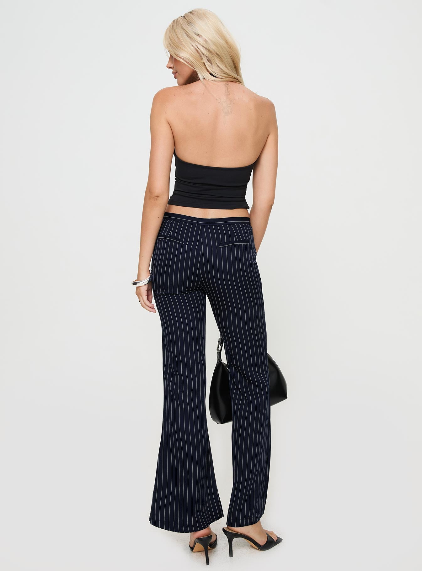back view of model wearing Princess Polly No One Low Waist Pinstripe Pants Navy Mid Rise 