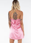 Strapless mini dress, silky material Inner silicone strip at bust, tie fastening at back, invisible zip at side