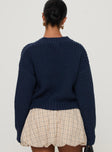 back view of model wearing Princess Polly Osias Cable Knit Cardigan Navy Cropped 