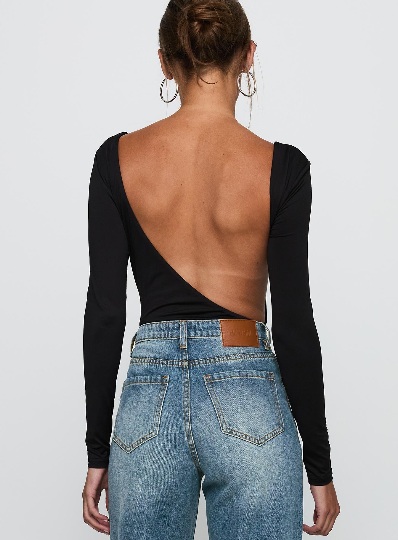 back view of model wearing Princess Polly Look This Good Backless Bodysuit Black Long Sleeve Tops 