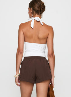 back view of model wearing Princess Polly Borderline Track Short Brown / Blue High Waisted Shorts 