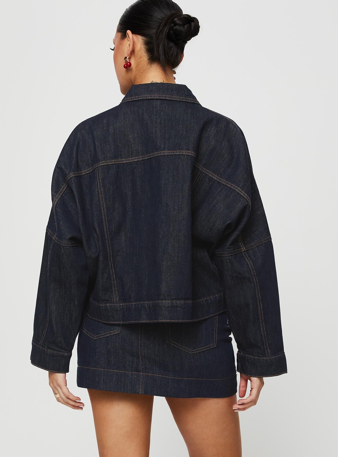 back view of model wearing Princess Polly Hughes Mini Skirt Dark Wash Denim Petite Mini Skirts 