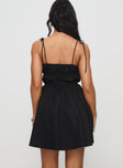 back view of model wearing Princess Polly Jacksonne Mini Dress Black Petite Square Neck 