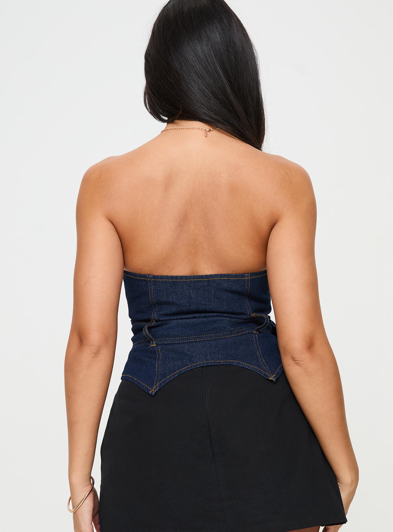 back view of model wearing Princess Polly Curl Curl Strapless Denim Top Dark Wash Sleeveless straight 