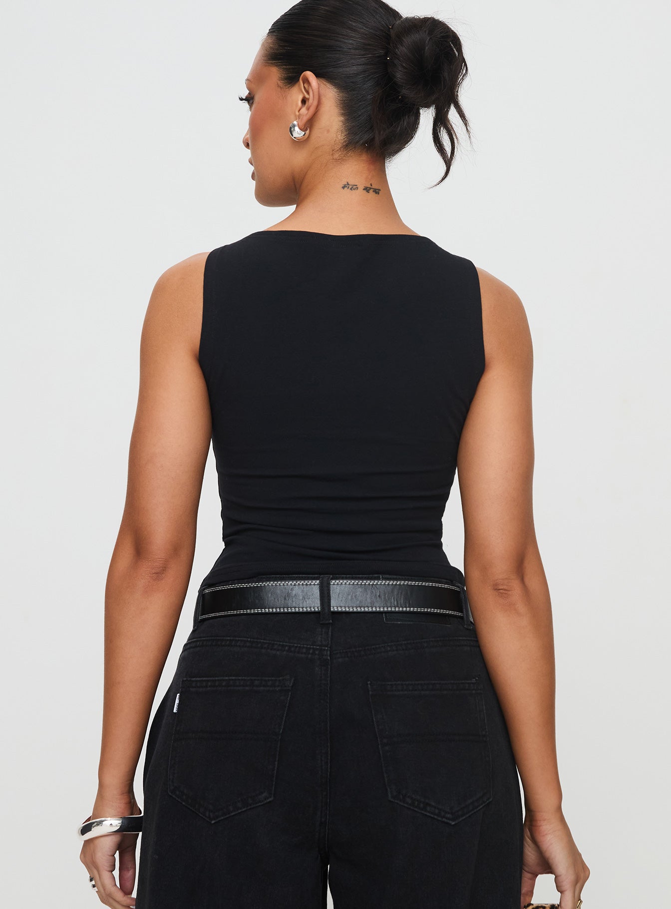 back view of model wearing Princess Polly Bleeker High Neck Top Black Sleeveless Boat Neck 