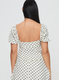 back view of model wearing Princess Polly Passionfruit Linen Blend Top Cream/Black Polka Dot Short Sleeves Square Neck 