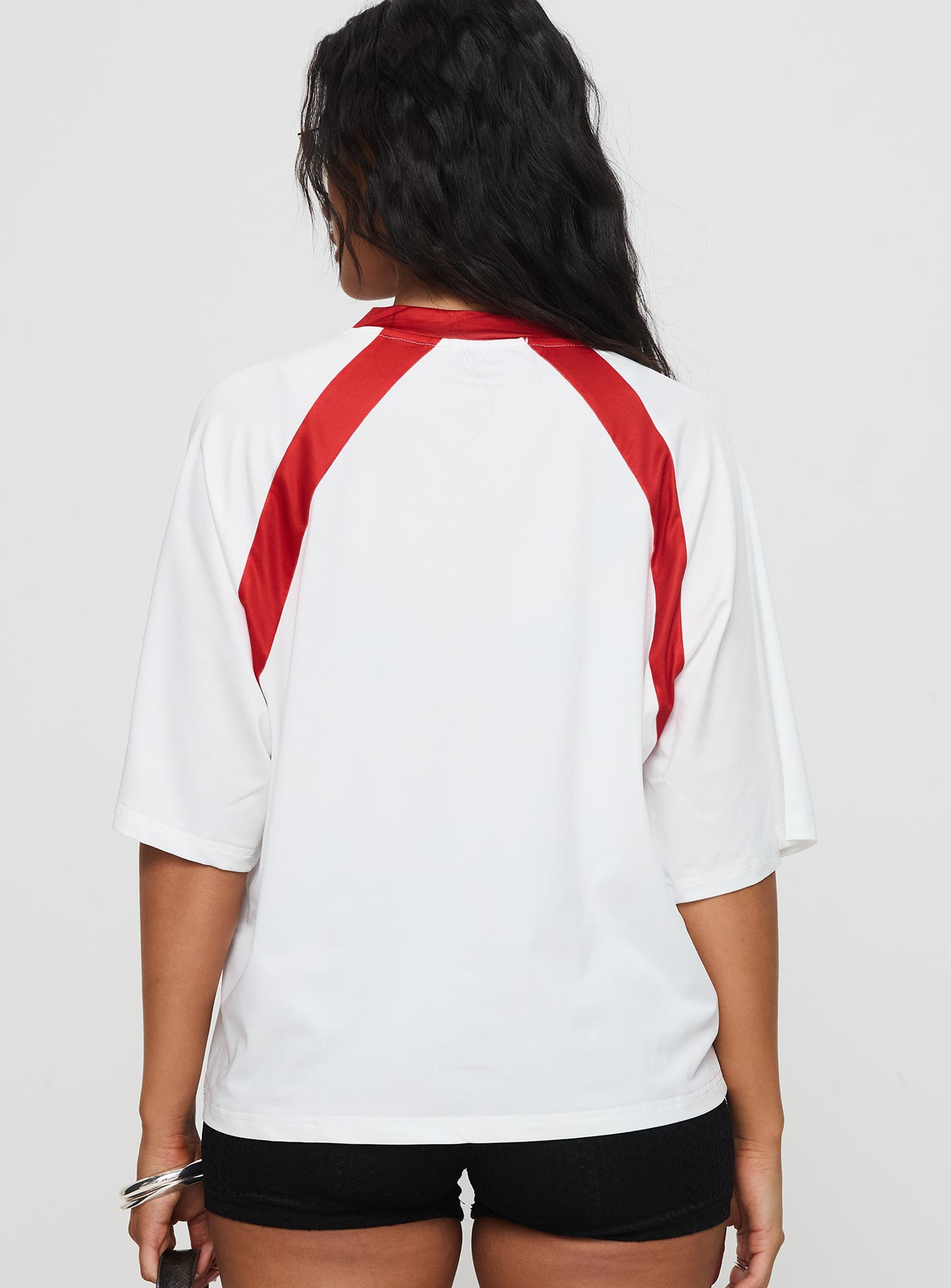 back view of model wearing Princess Polly One Star Top White / Red Half Sleeves V-Neck 