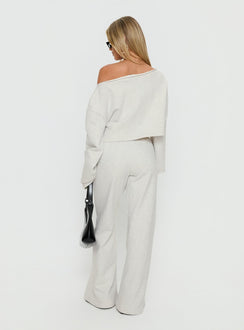 back view of model wearing Princess Polly Peaks Flared Track Pants Snow Marle Mid Rise Pants 