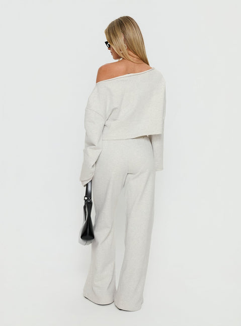 back view of model wearing Princess Polly Peaks Flared Track Pants Snow Marle Mid Rise Pants 