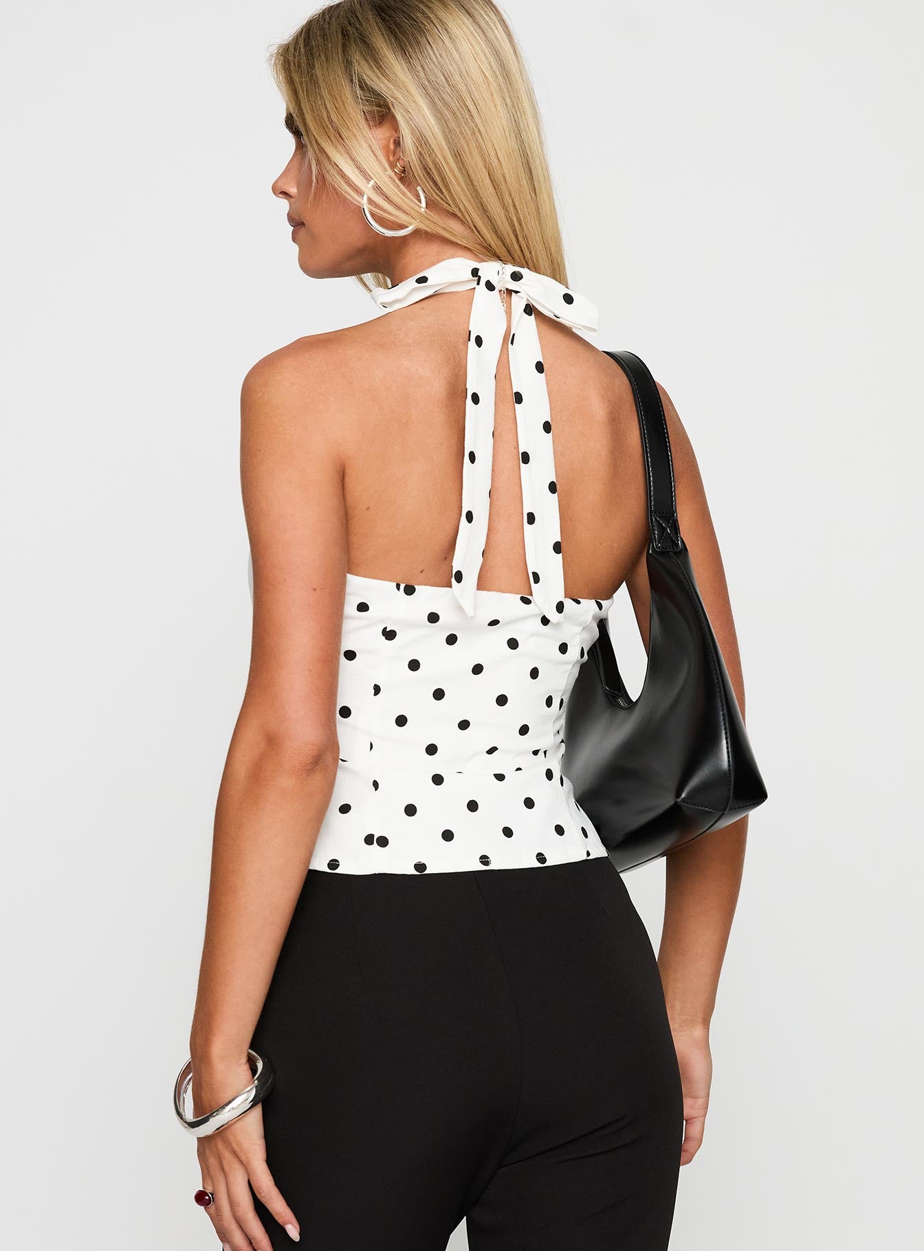 back view of model wearing Princess Polly Alter Of Love Halter Top White / Polka Dot Sleeveless Plunger 