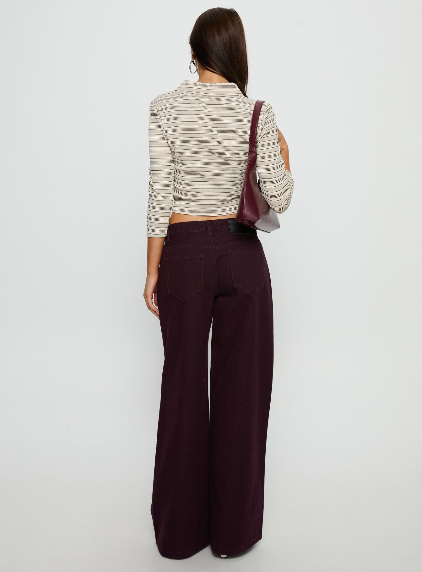 back view of model wearing Princess Polly Supercut Low Rise Baggy Pleat Jeans Currant Mid Rise Jeans 