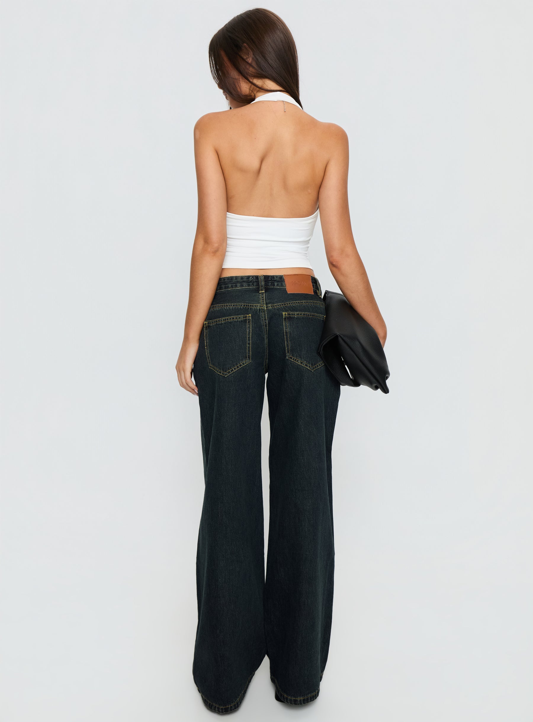 back view of model wearing Princess Polly Supercut Low Rise Baggy Pleat Jeans Grunge Wash Low Rise Jeans 